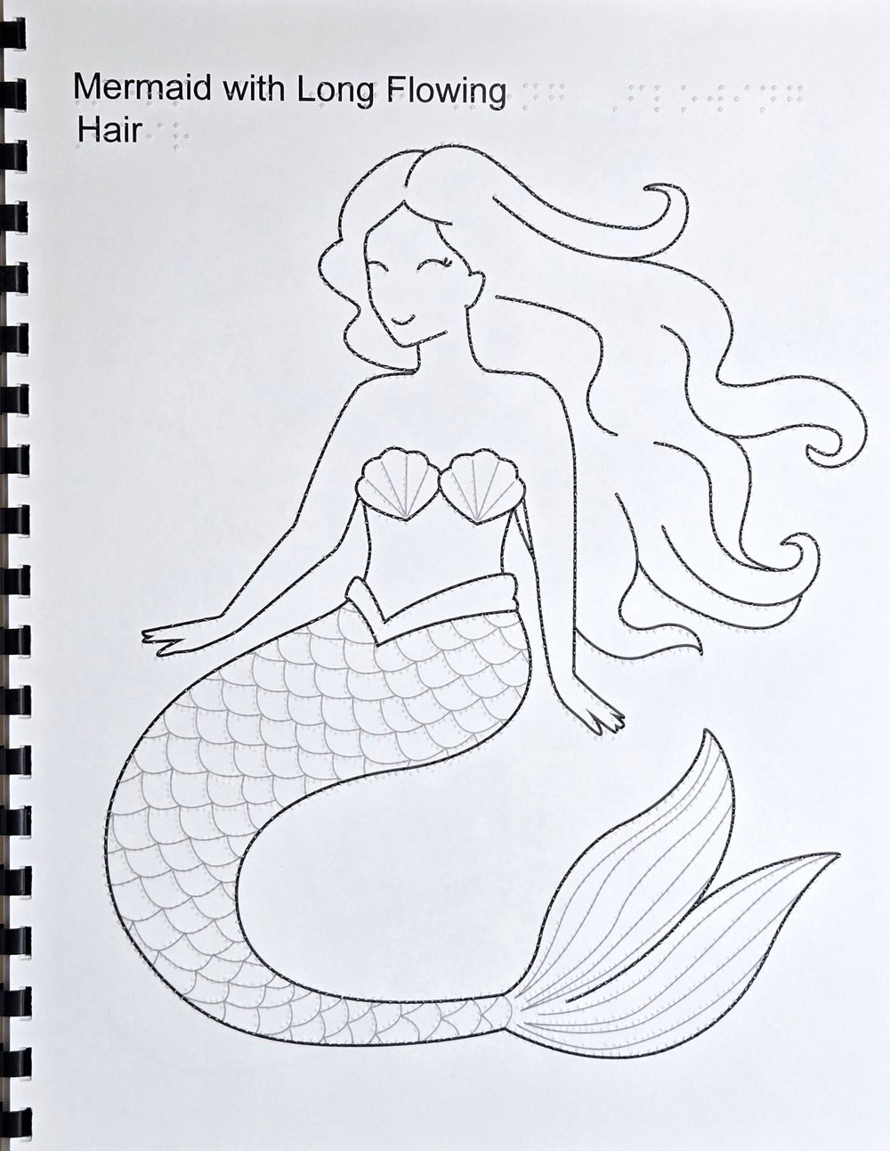 Page from a tactile coloring book: a mermaid with long hair, with the scales of the tail drawn as thin grey lines with raised dots